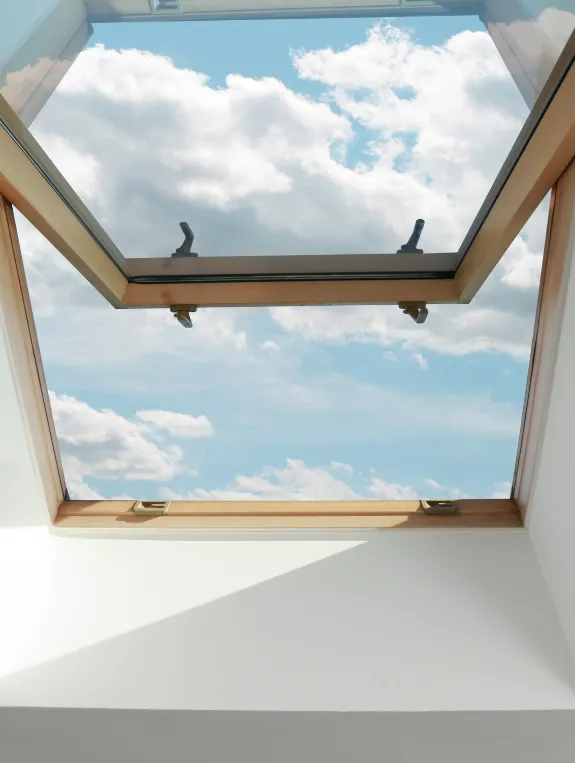 A Skylight in an Attic Transforms the Room Into Something Extraordinary